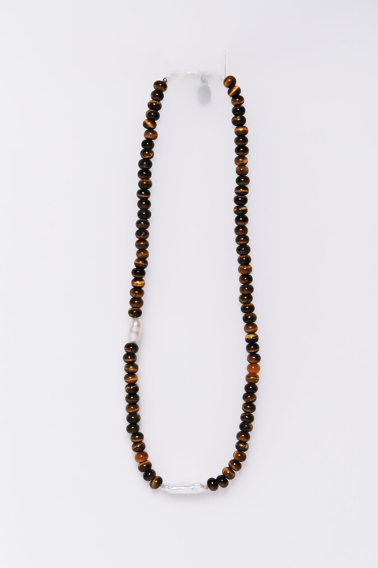 Tiger eye and freshwater pearl necklace displayed on a white background