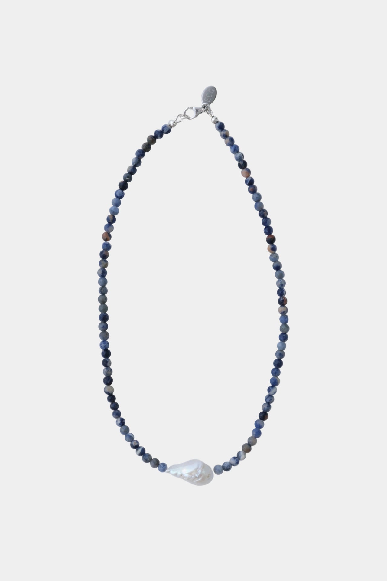 Necklace with blue stone beads and freshwater pearl on a white background