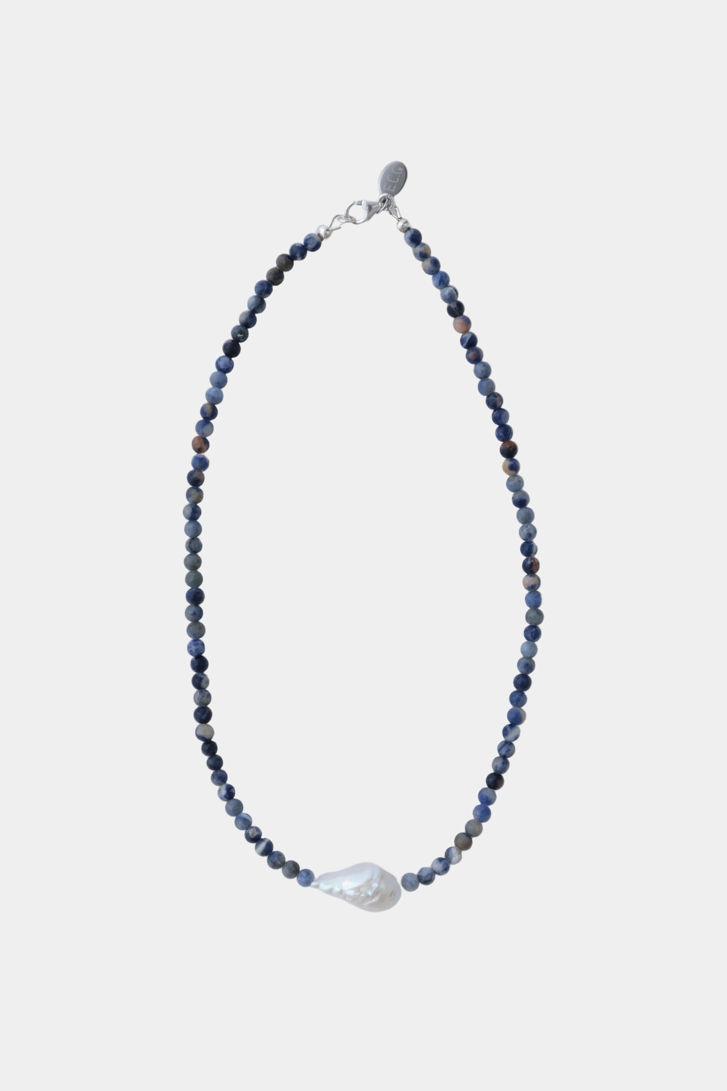 Necklace with blue stone beads and freshwater pearl on a white background