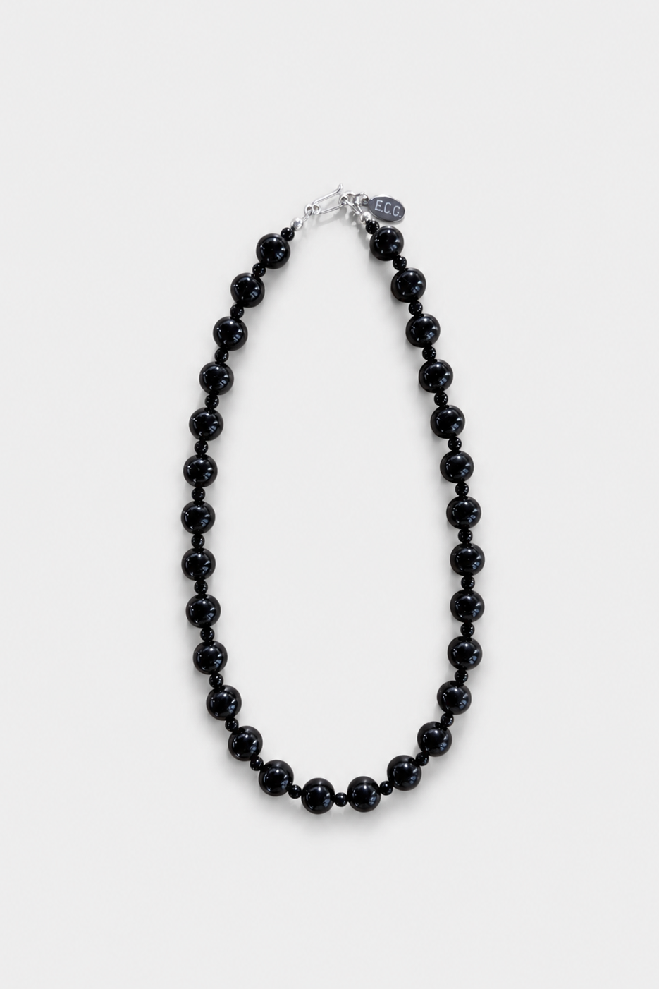 No. 4 necklace in black onyx beads with sterling silver hardware, displayed on a light grey background - East Coast General