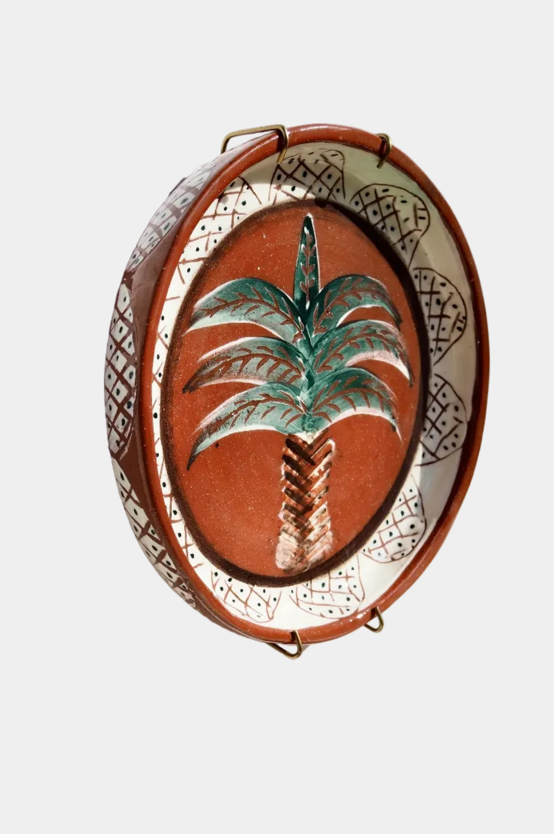 Decorative wall piece with palm tree design on a  white background
