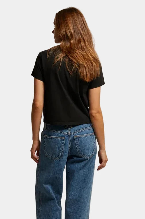 Back view of model wearing perfectwhitetee Springsteen cotton tee showing waist-skimming cropped hem