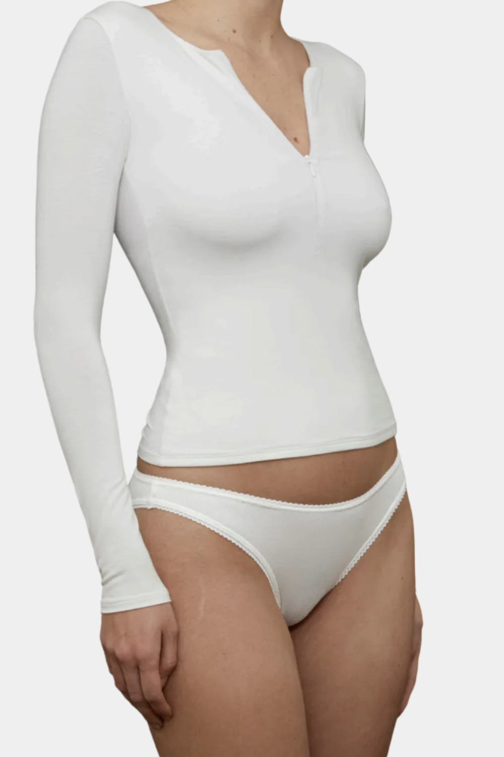 Model wearing the Kye Intimates recline half zip long sleeve top in natural viewed from the Front