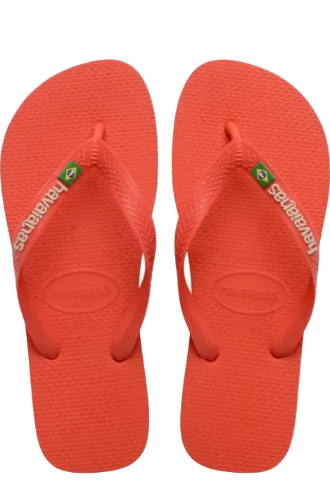 A pair of Havaianas Brazil logo flip-flops in a vibrant coral red color, shown from a top-down view on a plain white background - East Coast General