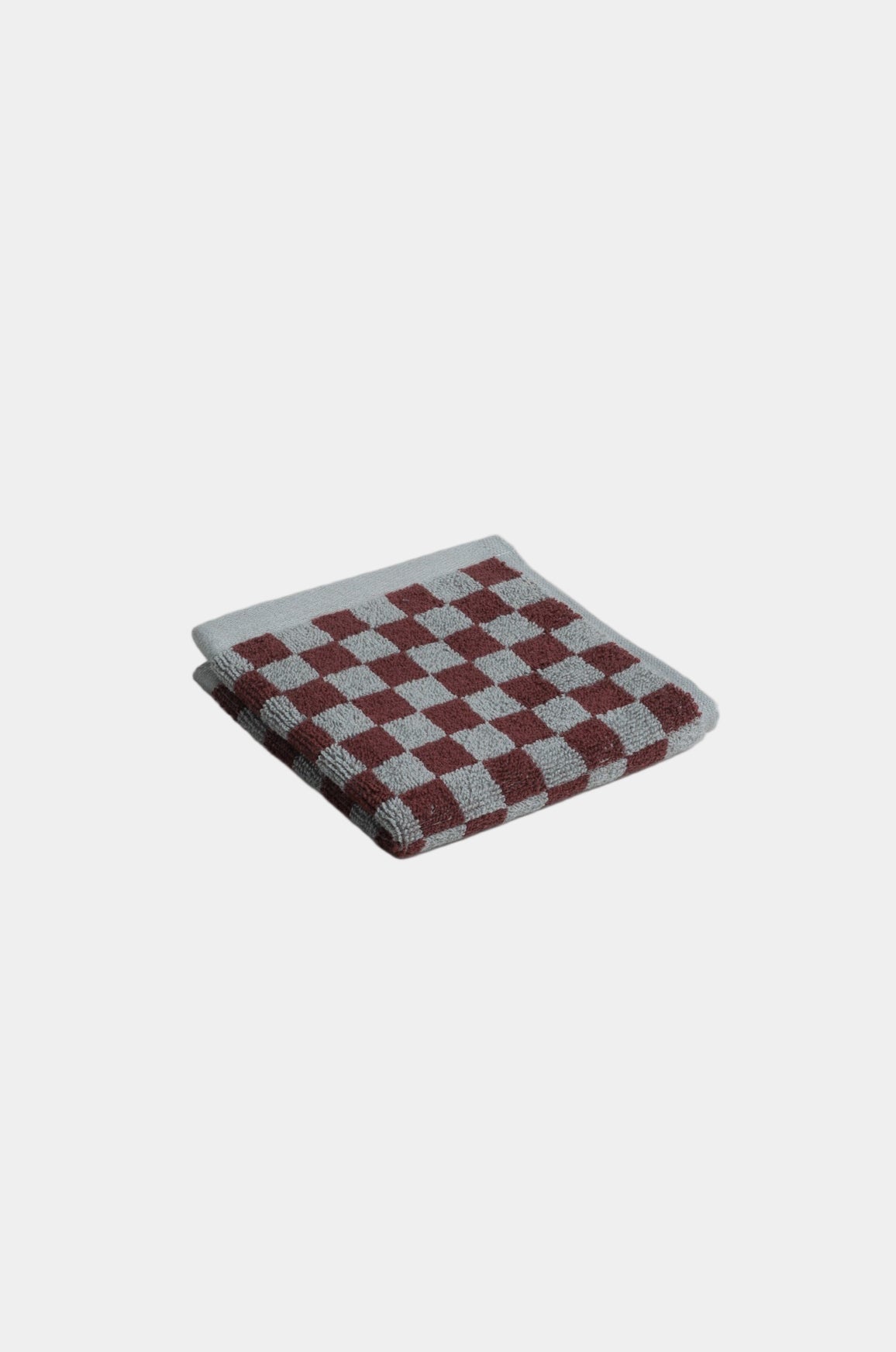 Checkered pouch with red and gray pattern on a light gray background