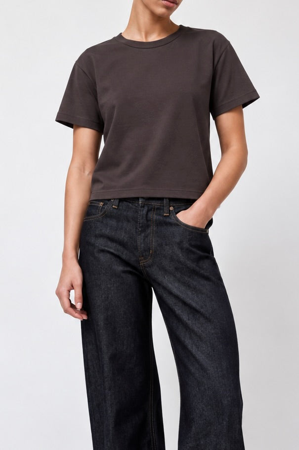 A model wearing Sunray Sportswear Hi'aka T-shirt in Raisin with B Sides Floppy Jeans - East Coast General