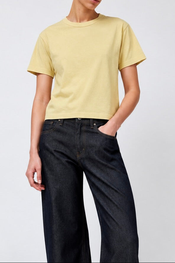 Model wearing the Sunray Sportswear Hiaka tshirt in Dried Moss with B Sides floppy jeans - East Coast General