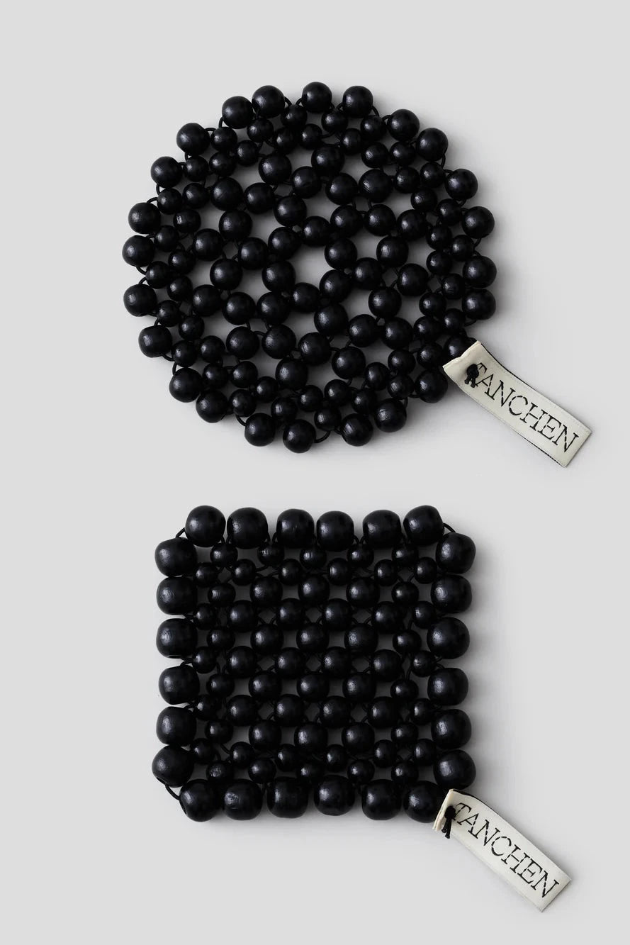 Two black beaded bracelets with 'LANCHEN' branding on a light gray background