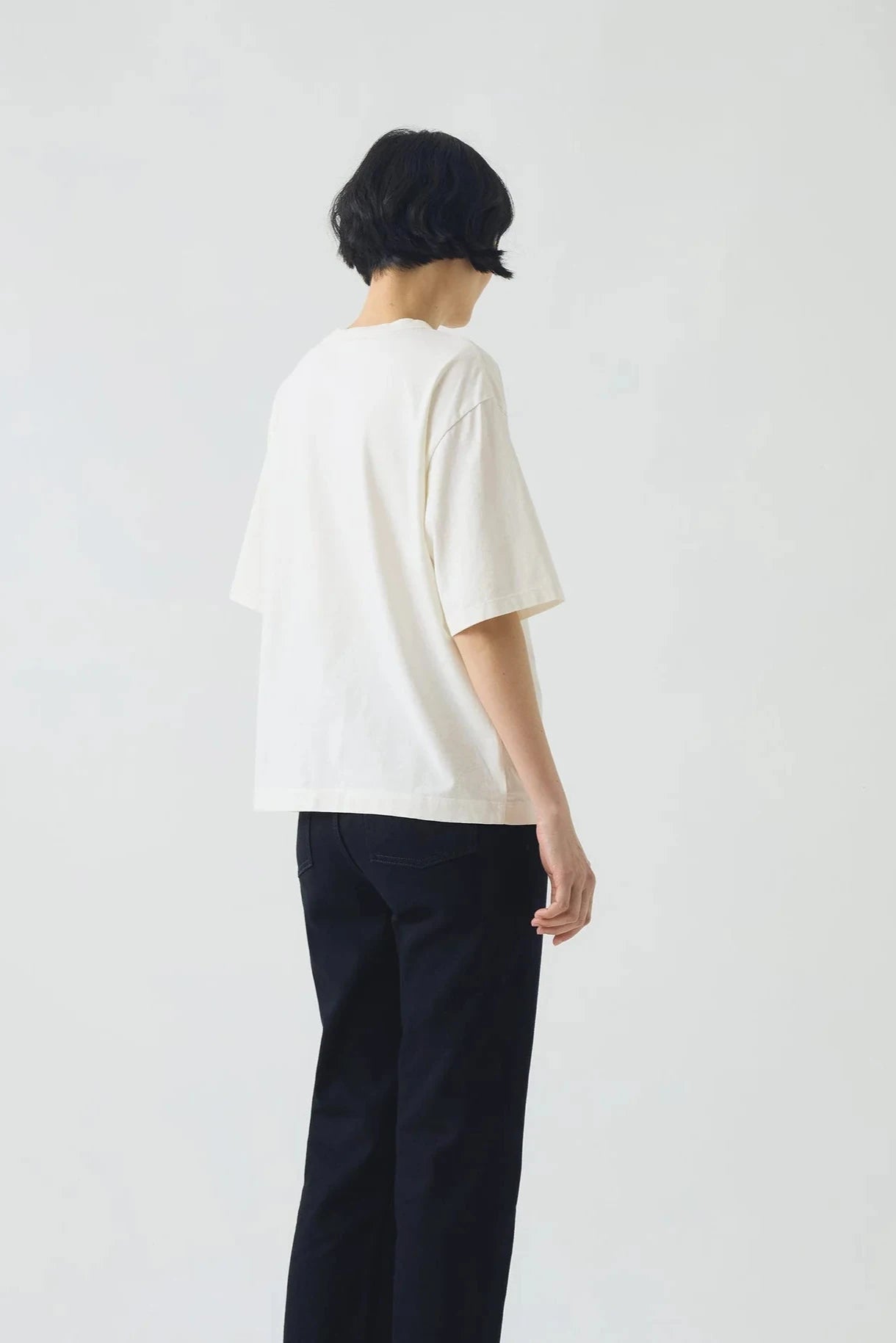 White t-shirt on a light gray background