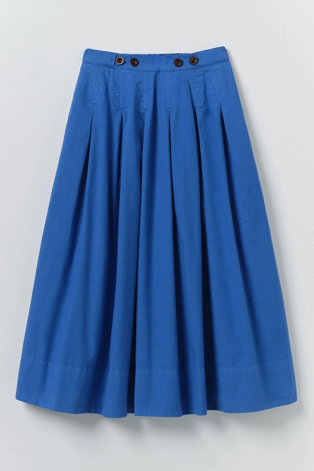 Blue skirt with black buttons on a light gray background