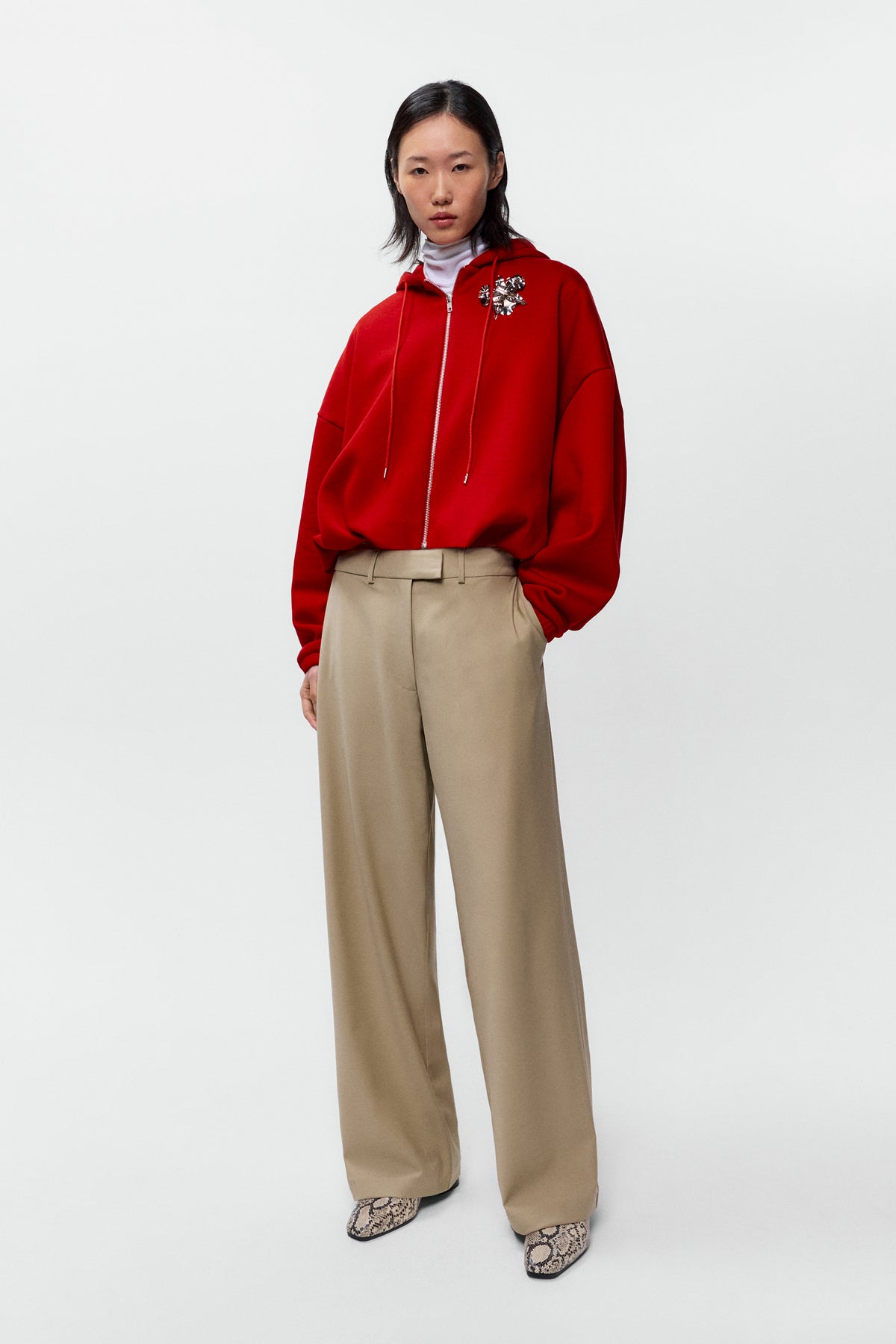 Front view of model wearing Cordera low rise virgin wool pants in beige with straight leg fit - East Coast General