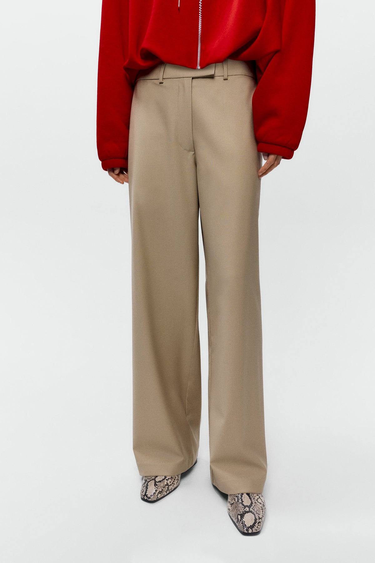 Front view  close up of model wearing Cordera low rise virgin wool pants in beige with straight leg fit - East Coast General