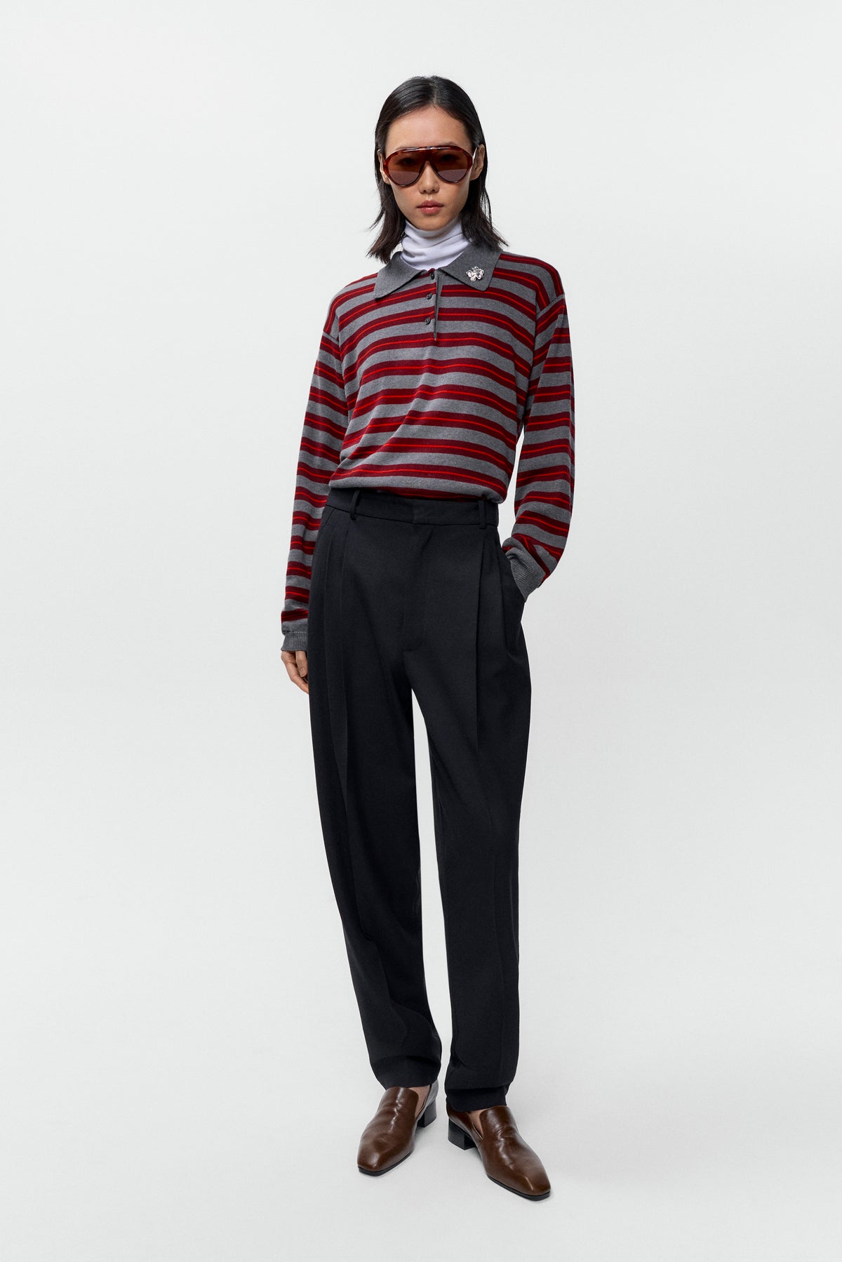 Front view of model wearing oversized Cordera Organic Cotton Striped Polo with open collar - East Coast General