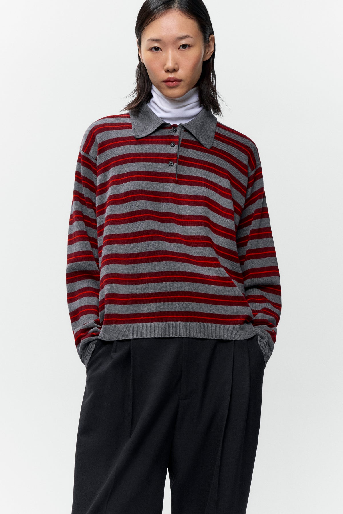 Front view of model wearing oversized Cordera Organic Cotton Striped Polo with open collar - East Coast General