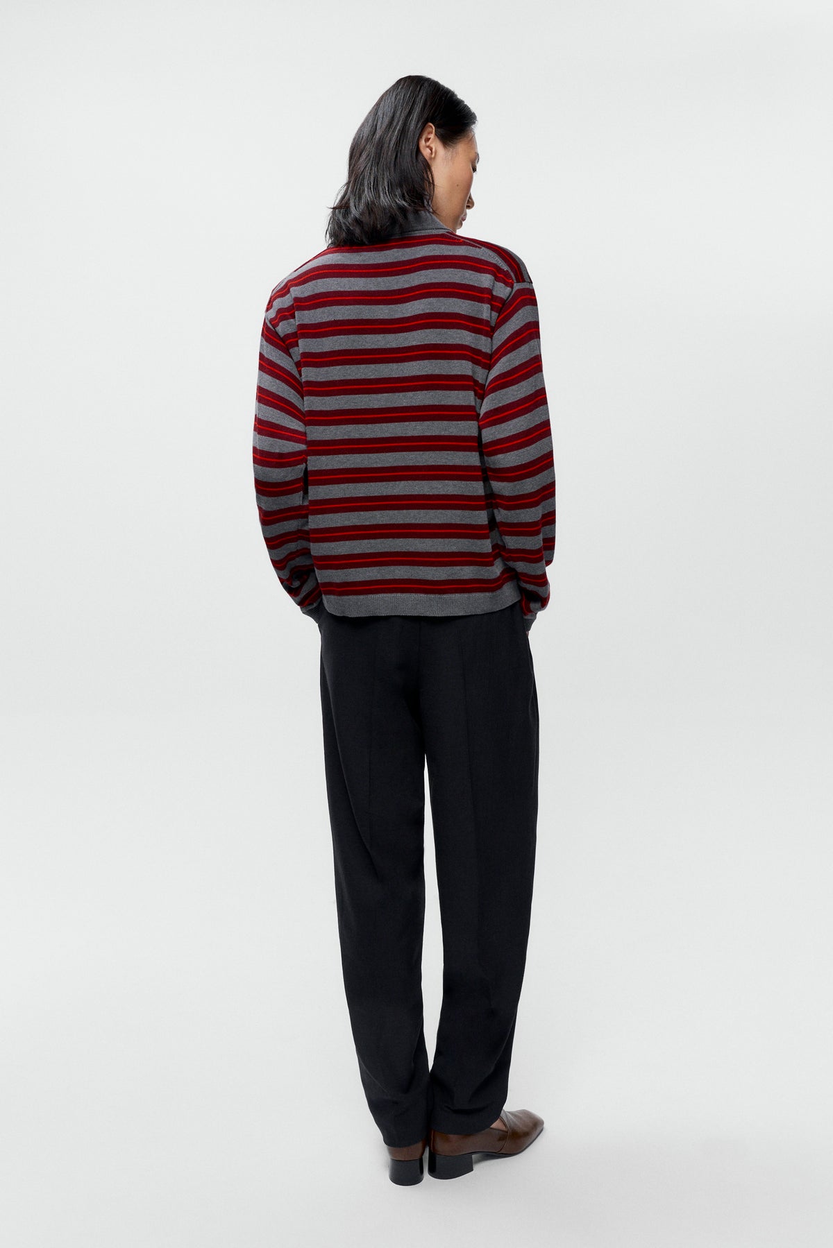 Rear view of model wearing oversized Cordera Organic Cotton Striped Polo - East Coast General
