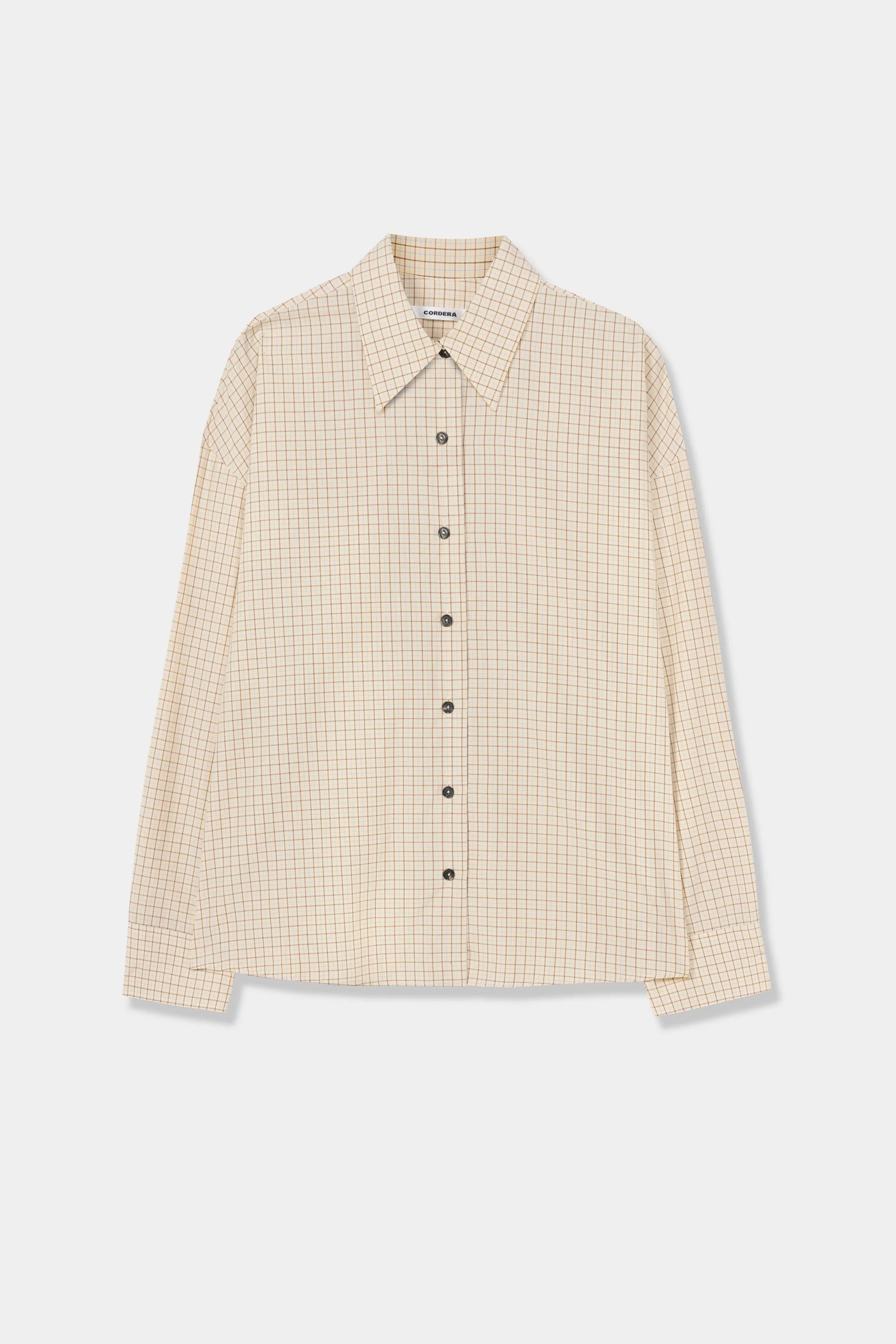 Checked oversized shirt on a plain background