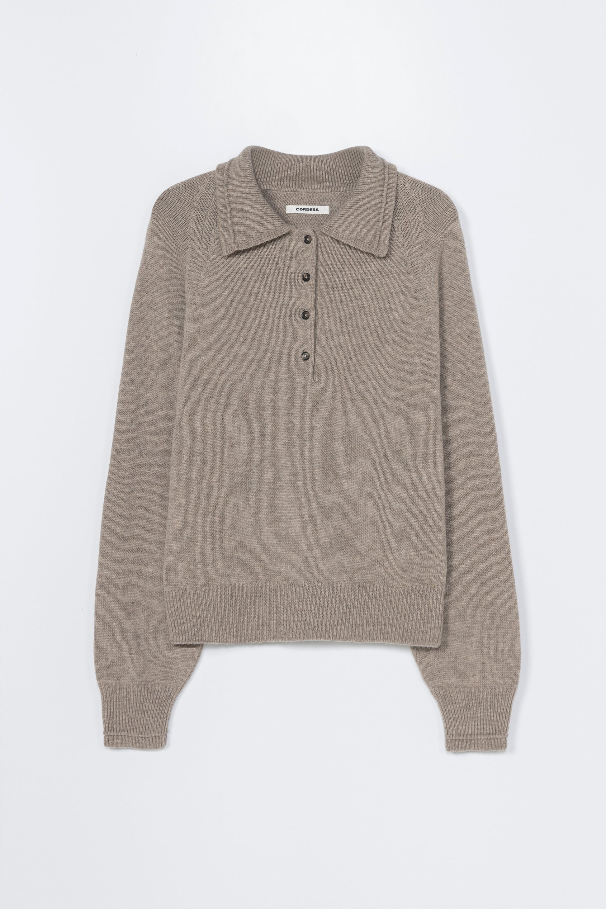 Brown knitted sweater with collar on a white background