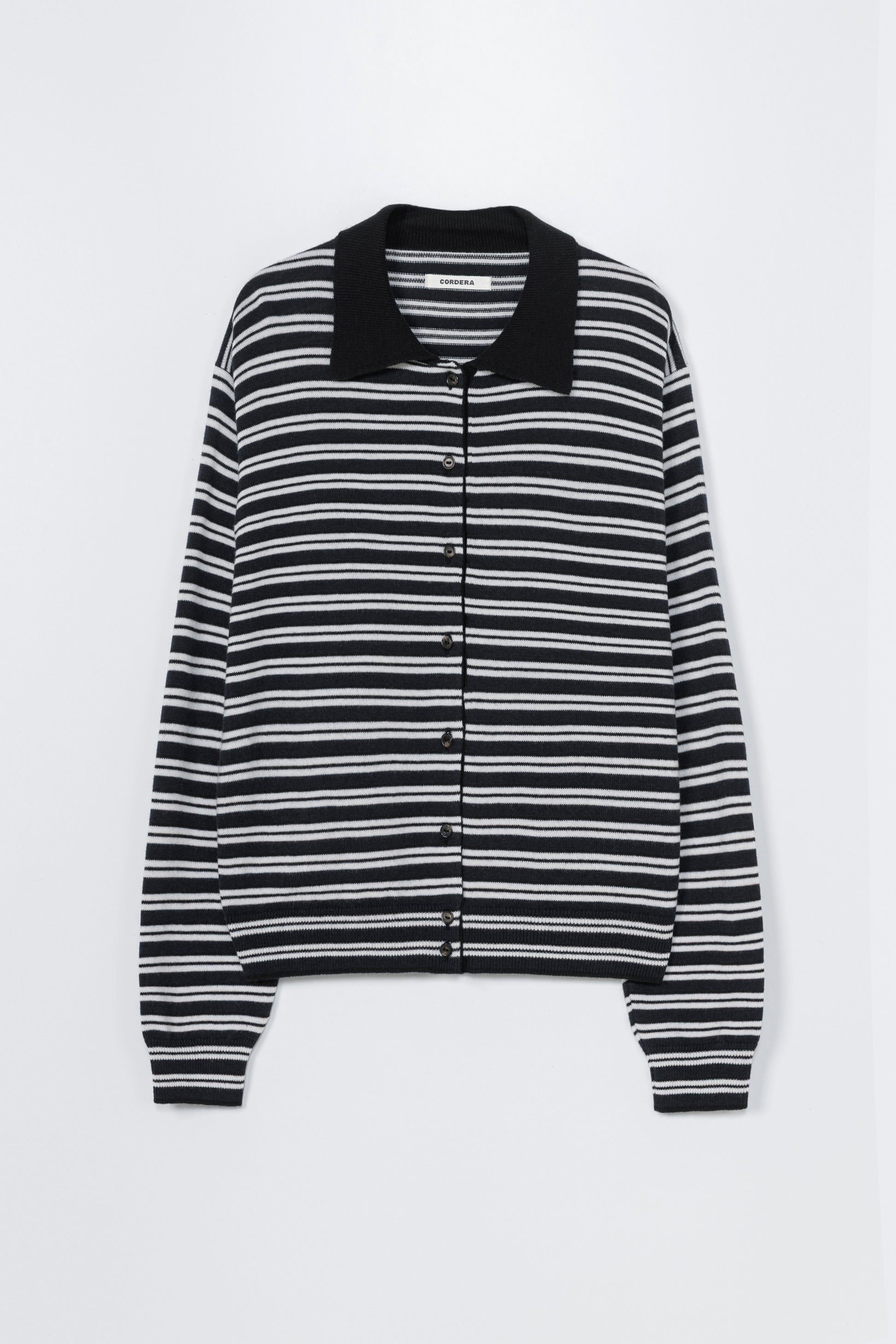Black and white striped cardigan with a collar on a white background