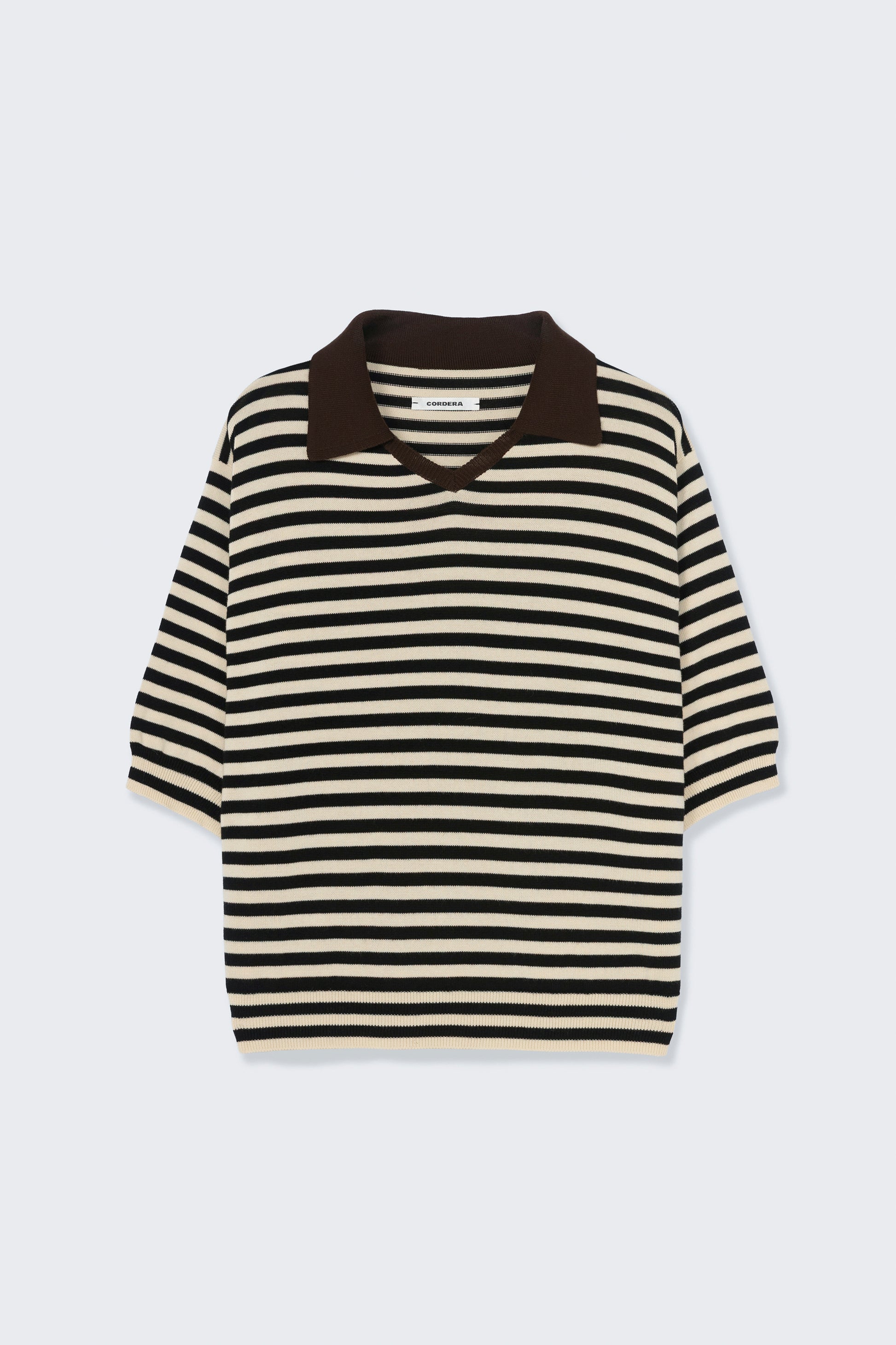 Black and white striped shirt on a light gray background