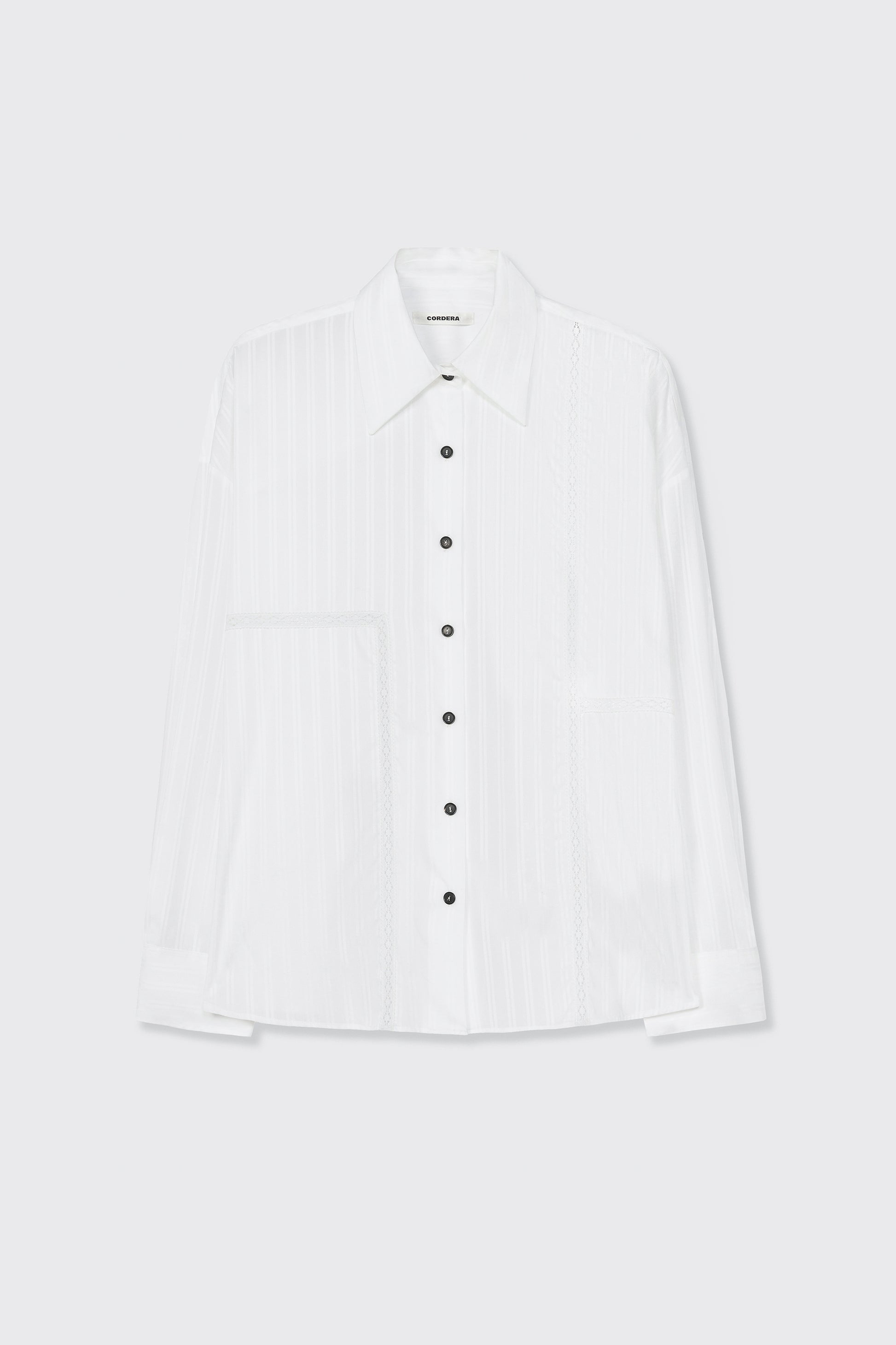 White button-up shirt on a light gray background