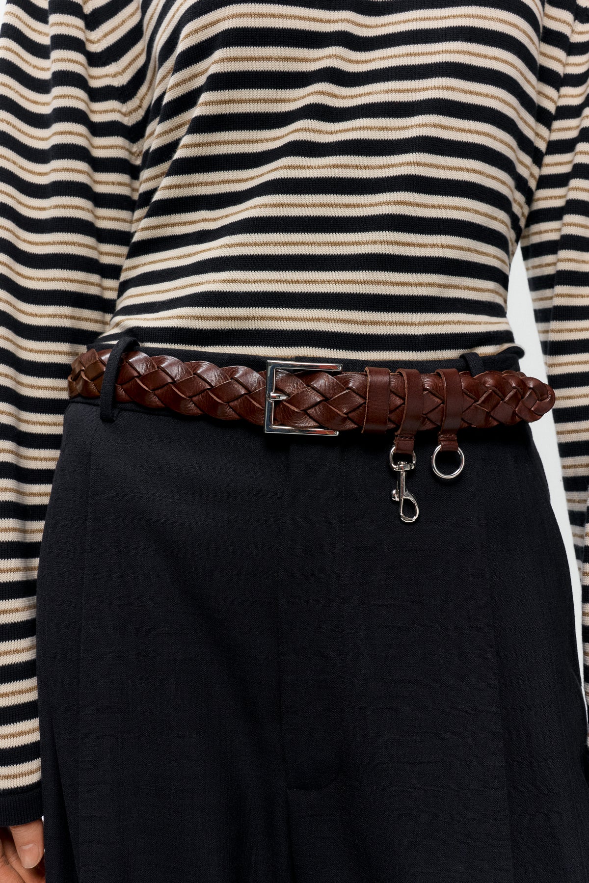 Cordera brown woven leather belt styled on mid rise tailored pants - East Coast General