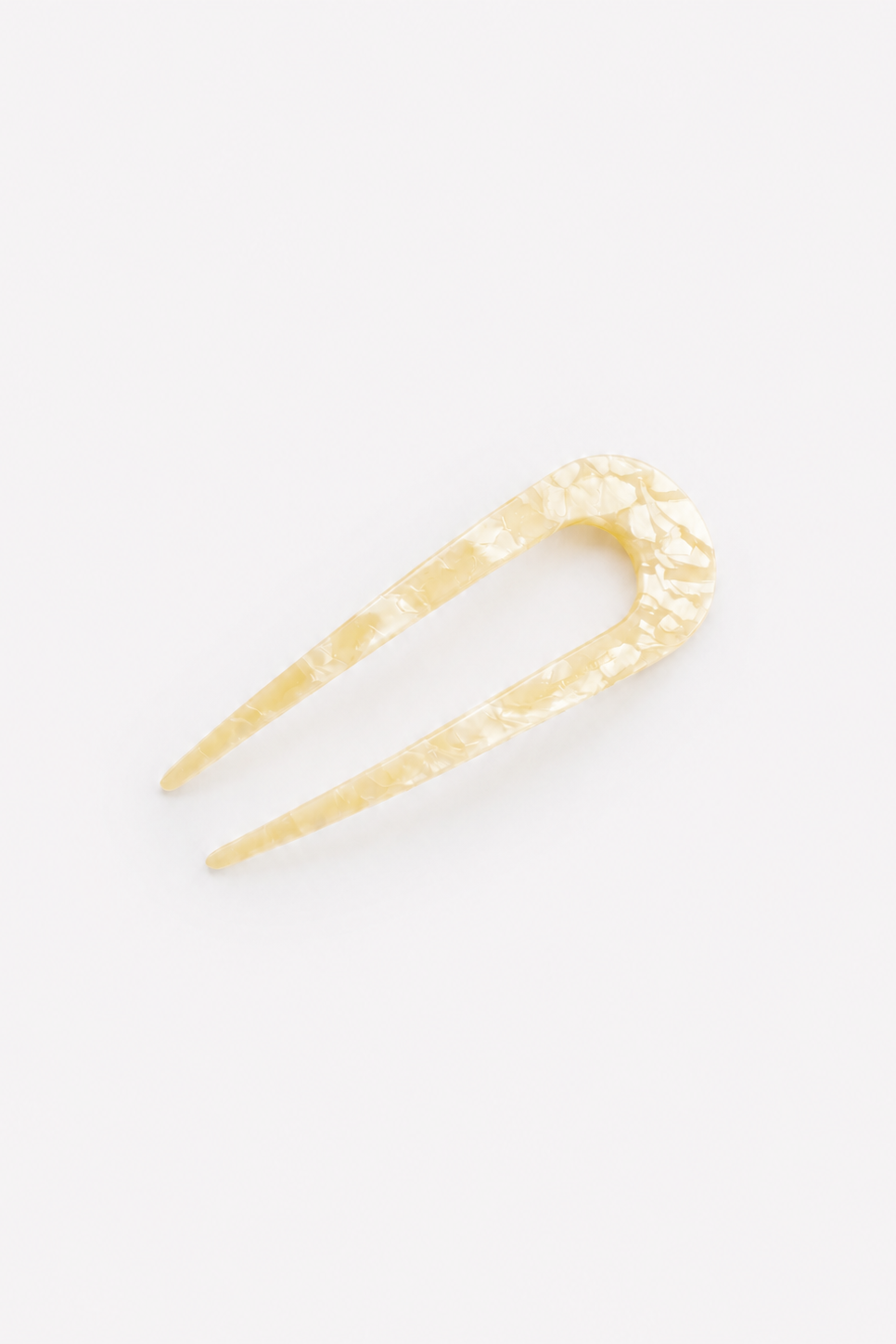 A single cream tortoise shell French hair pin, shown on a plain white background - East Coast General