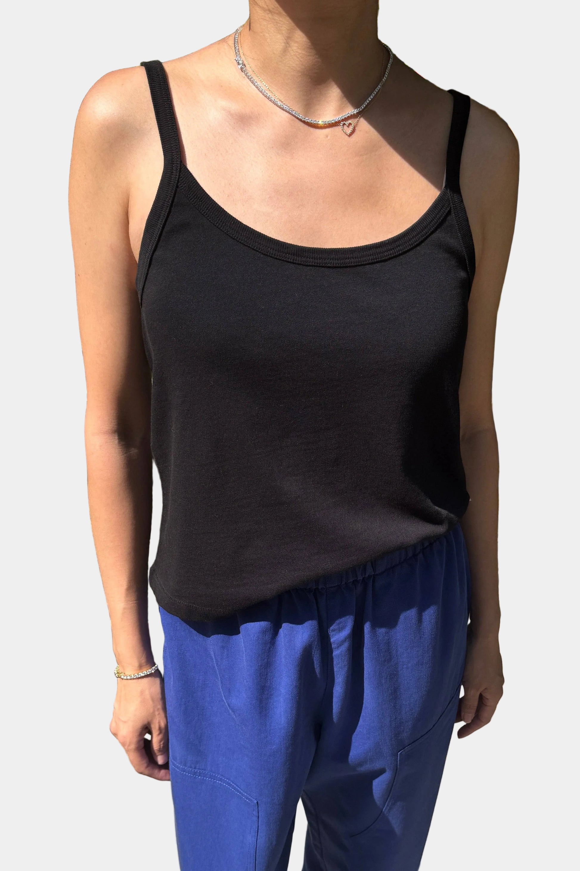Person Wearing the Le Bon Shoppe Dana tank in Black, viewed from the front - East Coast General