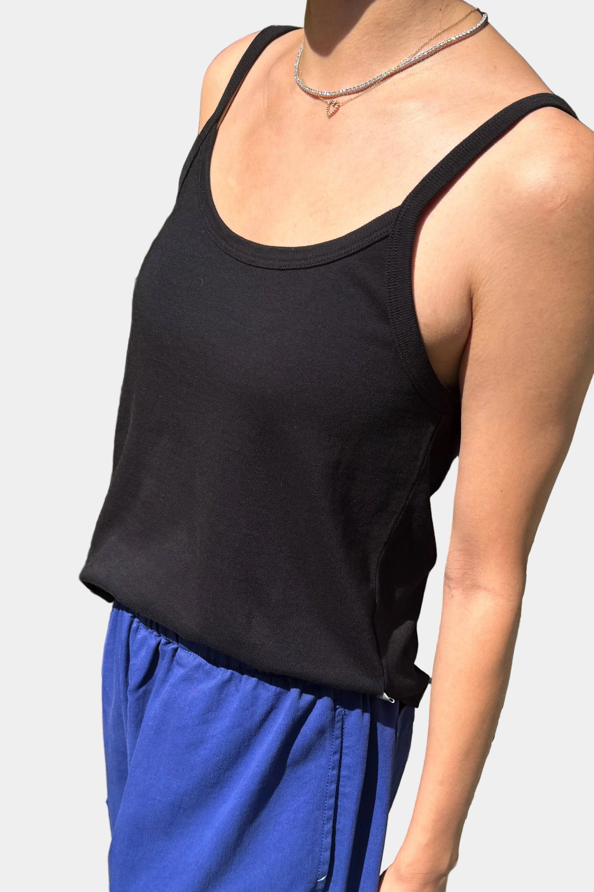 Person Wearing the Le Bon Shoppe Dana tank in Black, viewed from the side - East Coast General