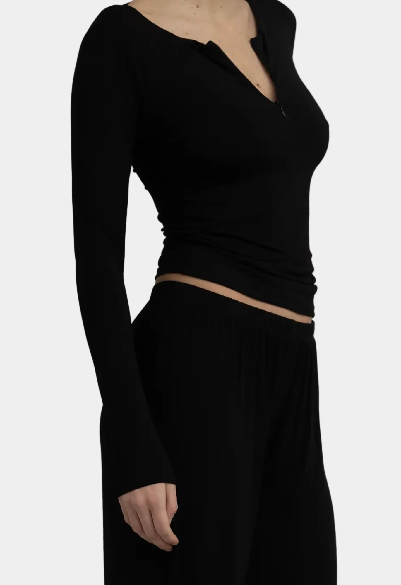 Side view showing collar detail and relaxed fit on KYE Intimates Black Recline Half Zip