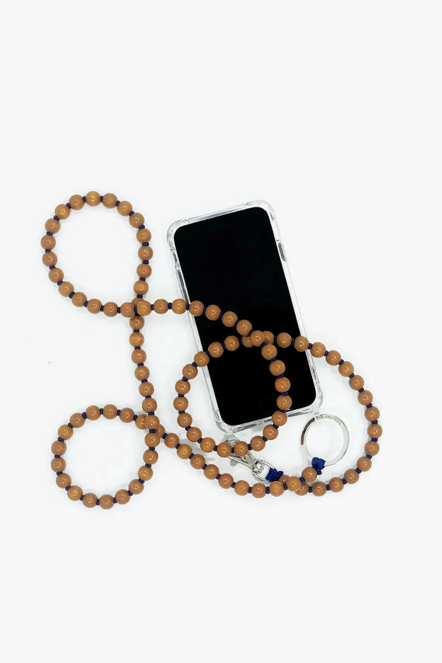 Navy and brown beaded phone necklace with silver hardware, displayed on a white background