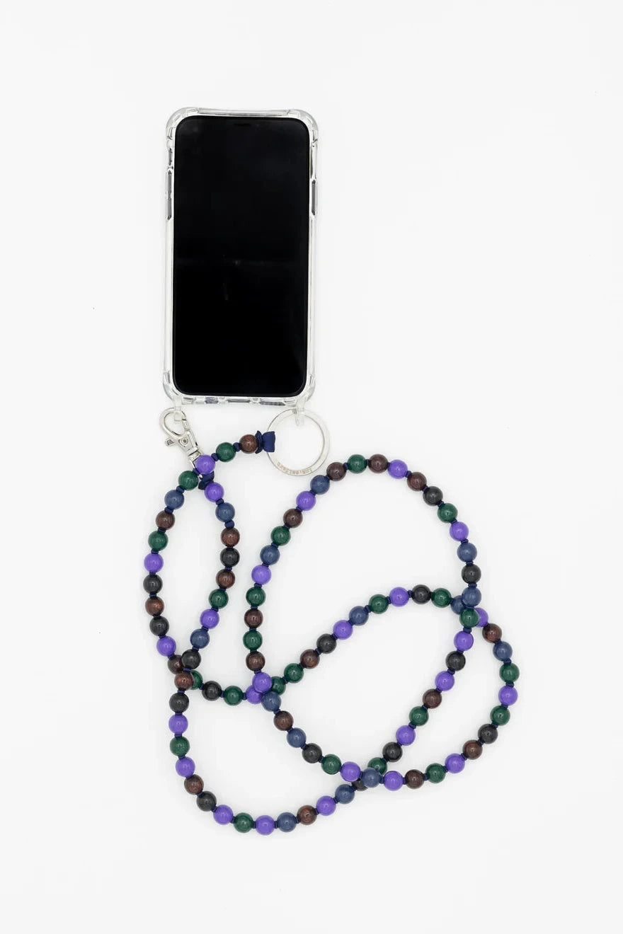 A phone necklace with black and multicolored threaded wooden beads, attached to a mobile phone with a silver adapter.