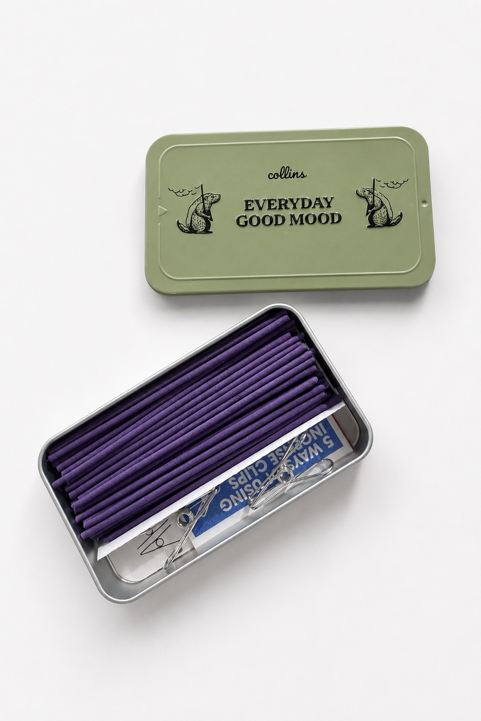 Collins purple pencils in a green metal tin with 'Everyday Good Mood' text on a white background