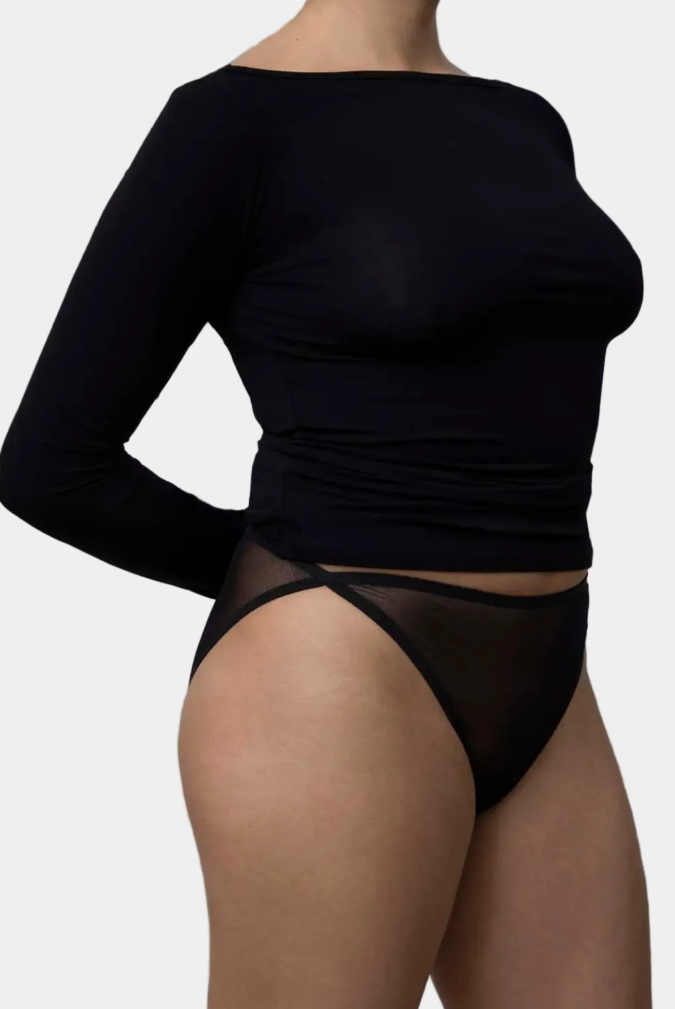 Side view showing slender sleeve fit on KYE Intimates Black Recline Bateau Long Sleeve
