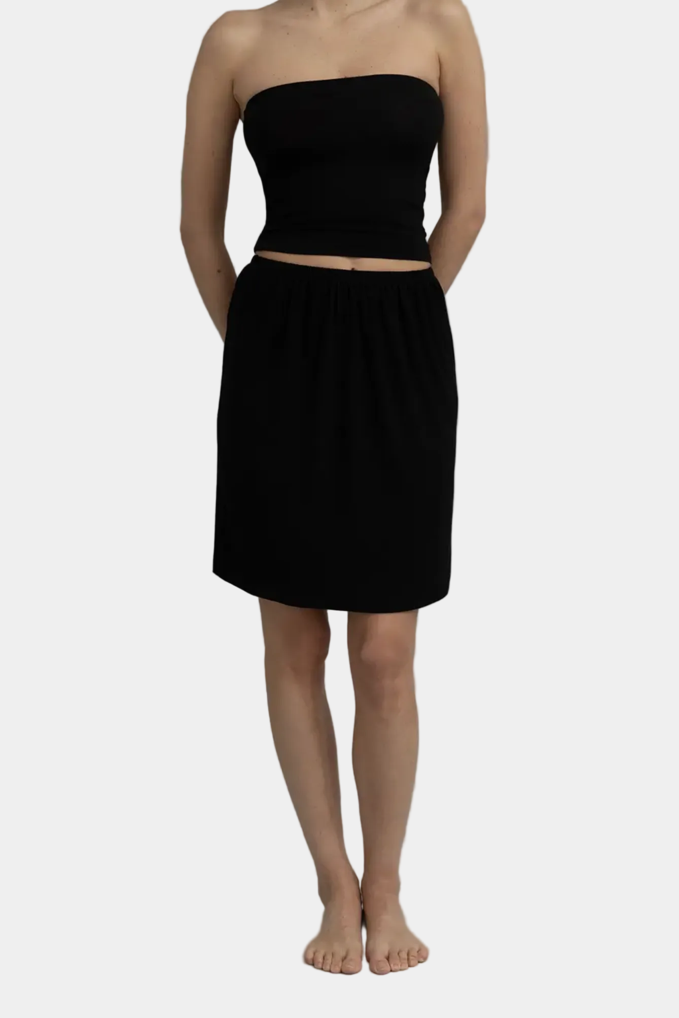 Model wearing KYE intimates Recline Skirt in Black fluid column maxi skirt front view - East Coast General
