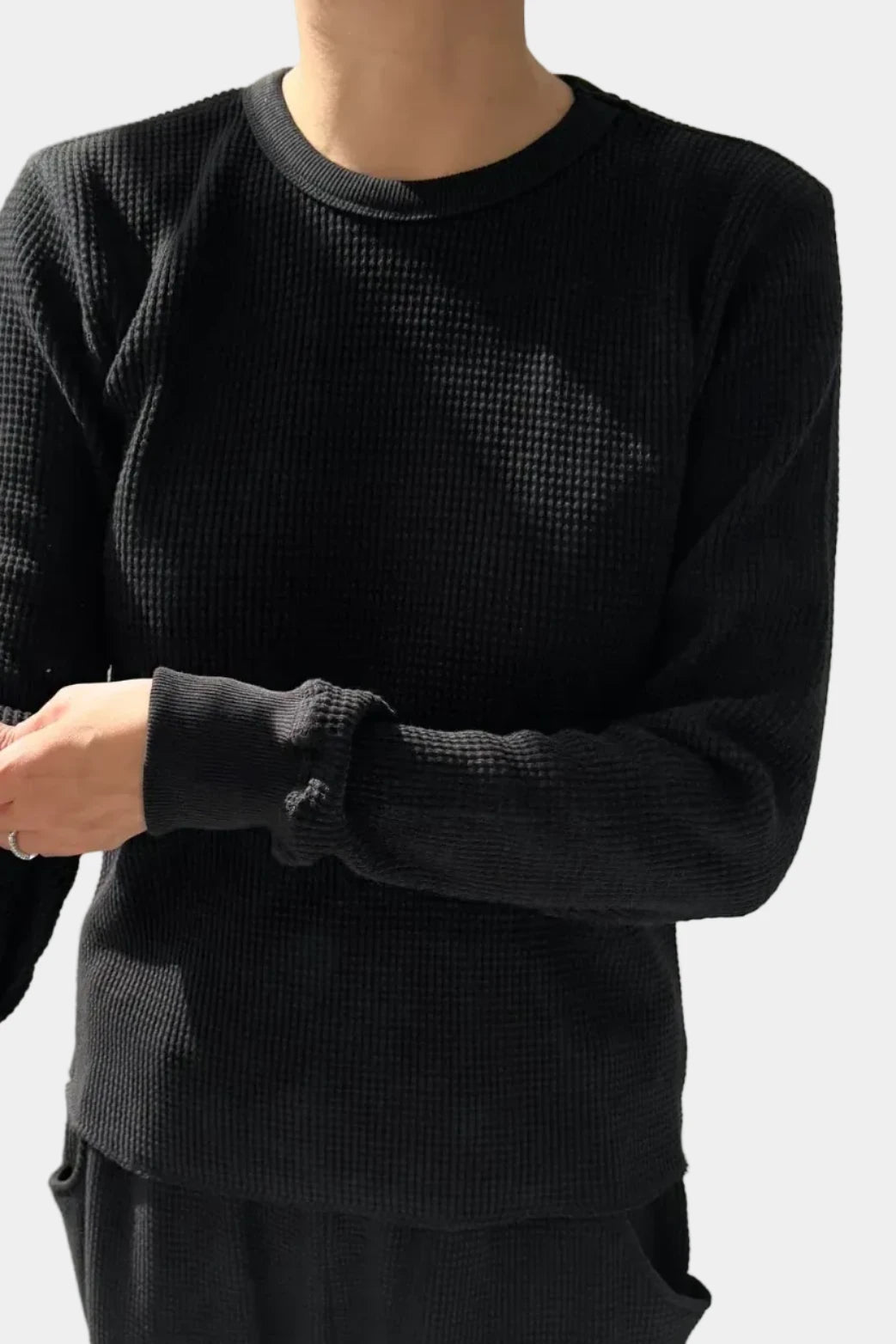 Model wearing Le Bon Shoppe True Black Waffle Fundamental Tee showing ribbed cuff detail - East Coast General