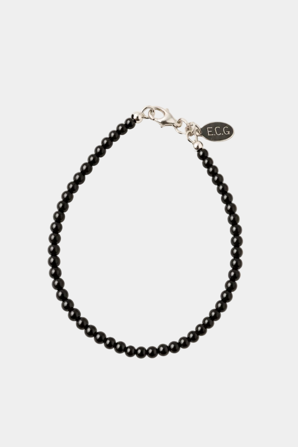 Black beaded bracelet with silver clasp on a white background