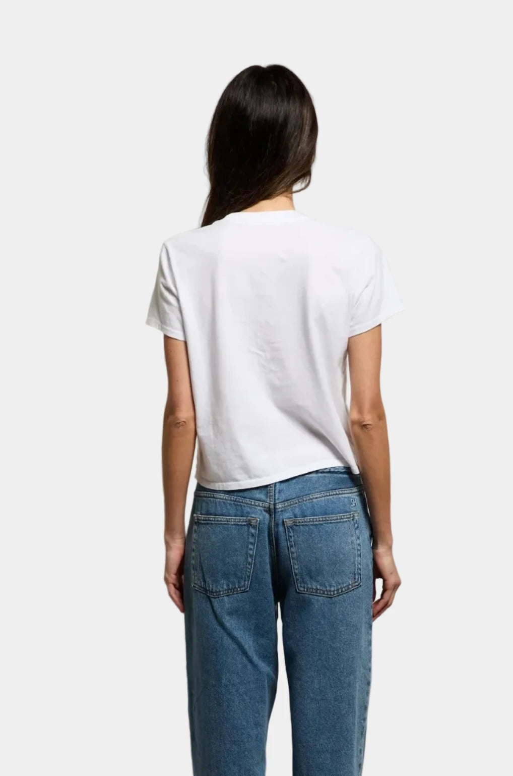 Rear view of a model wearing the perfect white tee Springsteen tshirt in white with blue jeans - East Coast General