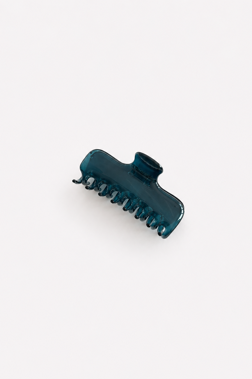 teal blue hair claw clip on a light grey background, photographed from above - East Coast General
