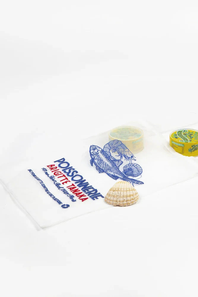 Two small containers with a shell on a white background, featuring a logo organza bag with fish illustrations on