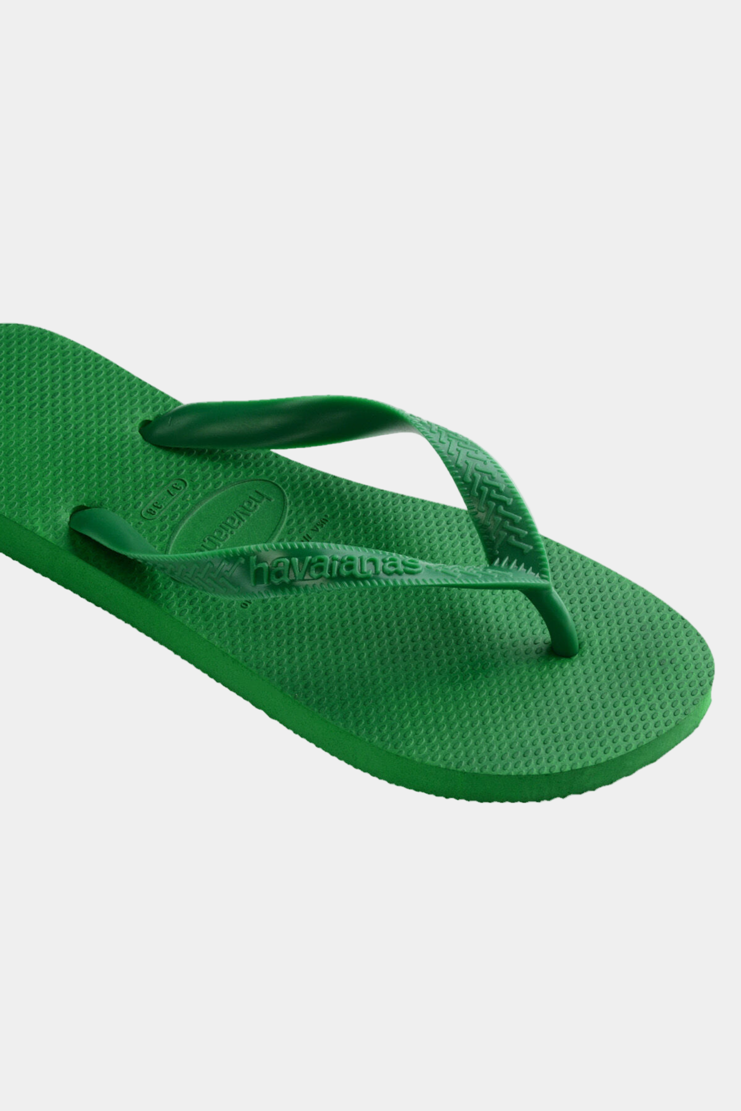 Green flip-flop sandal on a white background