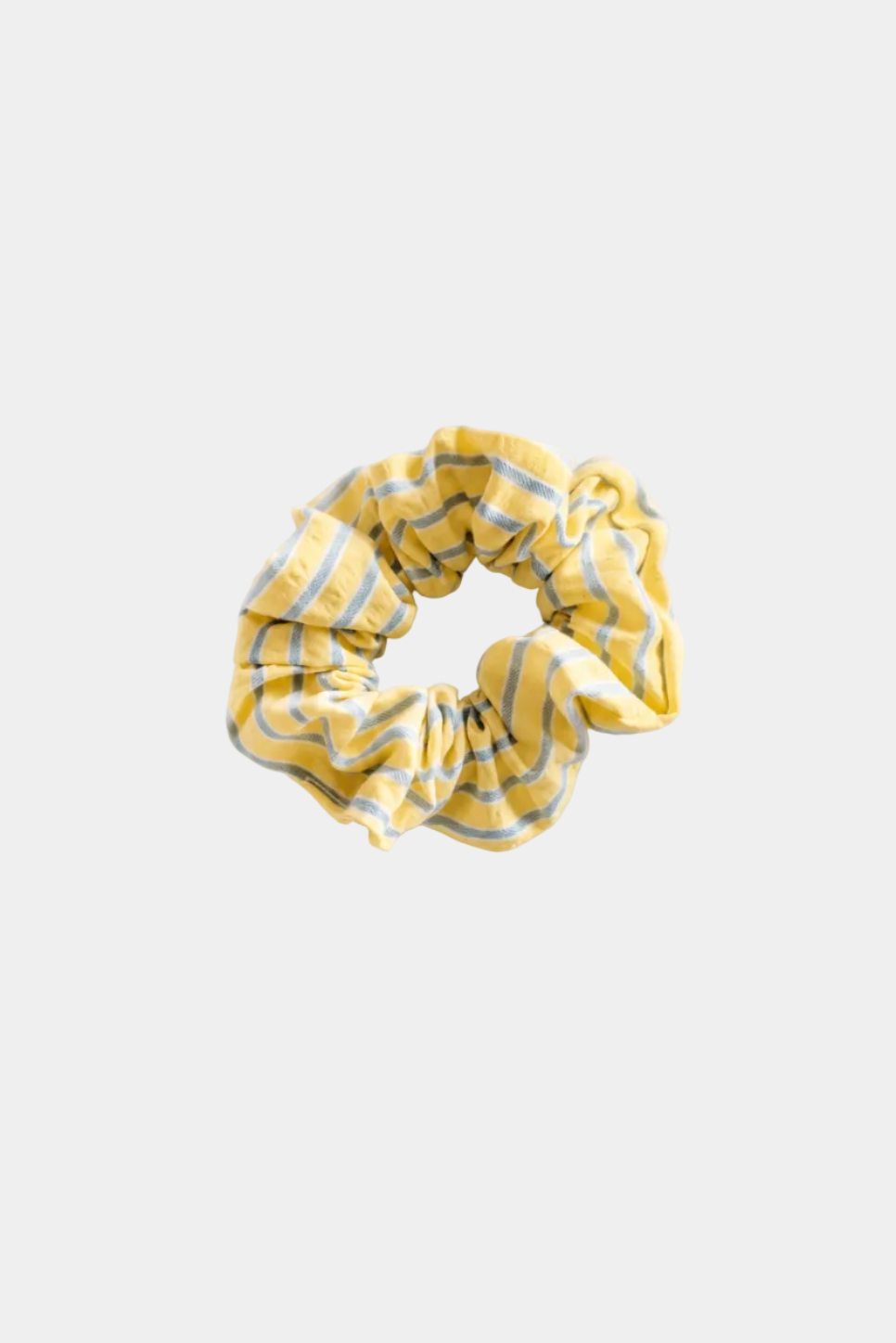 A yellow fabric scrunchie with thin blue stripes, photographed flat against a clean white background - East Coast General